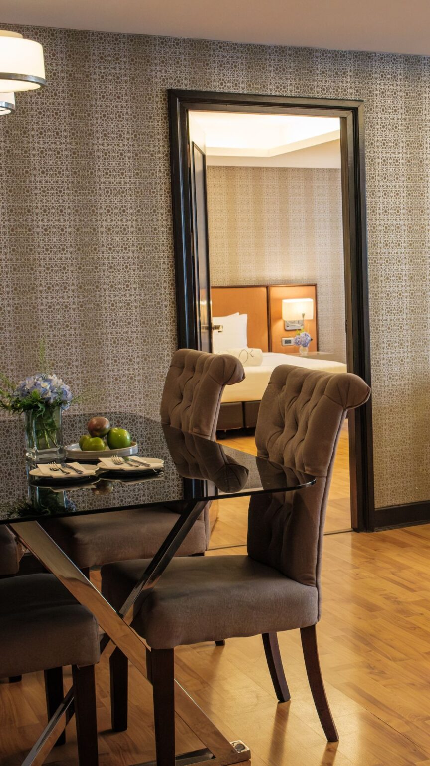 Guest enjoying relaxing dining experience inside spacious Bangkok hotel room