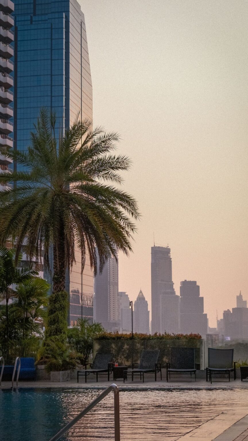 Sunrise and sunset pool atmosphere with Bangkok skyline view