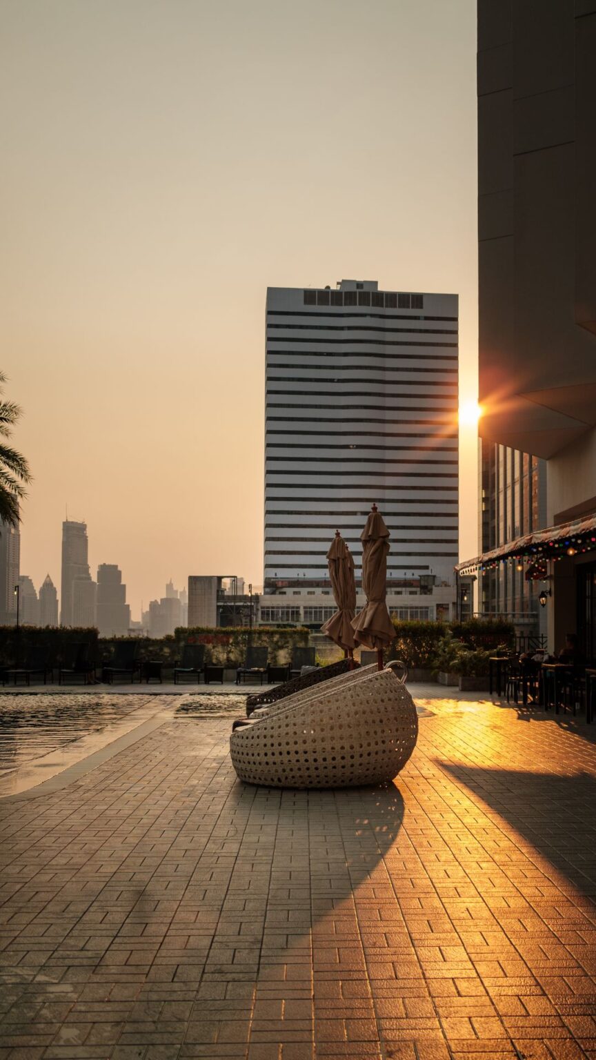 Sunset atmosphere at rooftop-style swimming pool in Bangkok hotel